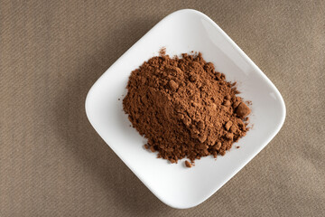 Cacao. Pile of cocoa powder in plate