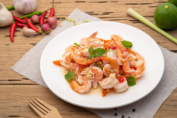 Spicy salad with shrimp,Thai boiled shrimps with lemongrass in chilli lime sauce in white plate