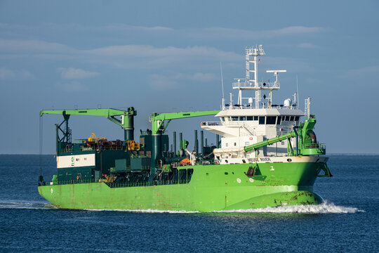 CUXHAVEN, GERMANY - NOVEMBER 23, 2022: DEME trailing suction hopper dredger MEUSE RIVER on the river Elbe