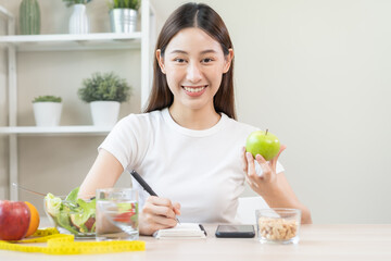 Diet, Dieting attractive asian young woman, girl working, write diet plan right nutrition with eat...