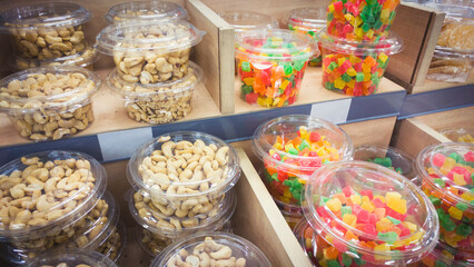 Various nuts and candied fruits on market's showcase