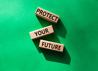 Protect your future symbol. Concept words Protect your future on wooden blocks. Beautiful green background. Business and Protect your future concept. Copy space.