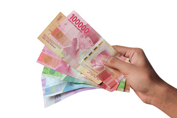 hand with rupiah banknotes