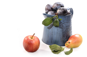plum in a garden metal jug