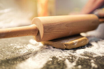 rolling pin on short pastry dough covered with flour
