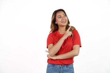 Studio shot of pretty Asian woman with red t-shirt isolated on white background. Pointing blank area