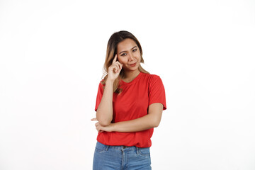 Studio shot of pretty Asian woman with red t-shirt isolated on white background. Thinking