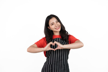 Heart Shape, Food shop owner concept, Smiling young confident asian woman in black apron and red t-shirt isolated on white background.