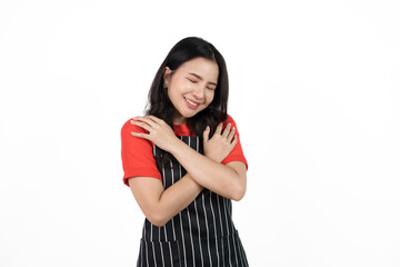 Love yourself, impressive, Food shop owner concept, Smiling young confident asian woman in black apron and red t-shirt isolated on white background.