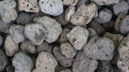 Detailed surface texture of a pile of pumice as a background