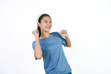 Beautiful Asian woman in blue t-shirt isolated on white background. Dancing