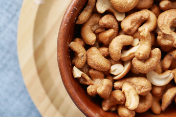close up of cashew nuts in a bowl on table 
