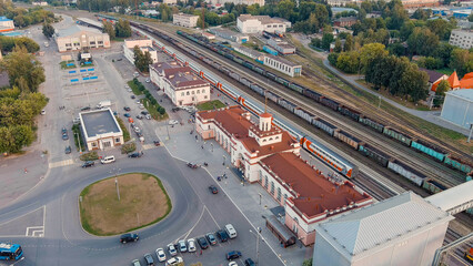 Fototapeta na wymiar Yoshkar-Ola, Russia - September 24, 2022: Train Station. Panorama of the central part of the city from the air during sunset, Aerial View