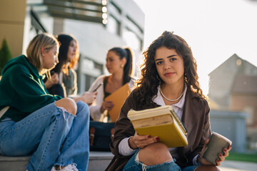 Portrait of a college student sitting ion the stairs