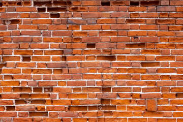 Red old brick wall. Texture background of broken bricks wall