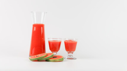 Papaya smoothie in glass jar and glasses on white background diet vegetarian healthy and freshness drink concept soft and selective focus