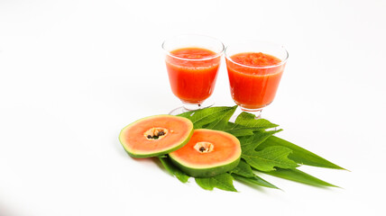 Papaya smoothie in glass jar and glasses on white background diet vegetarian healthy and freshness drink concept soft and selective focus