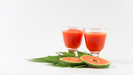 Papaya smoothie in glass jar and glasses on white background diet vegetarian healthy and freshness drink concept soft and selective focus