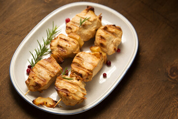 Chicken kebab with spices on a dark background