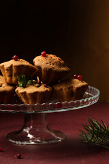 cupcakes with lingonberries on a glass dessert stand