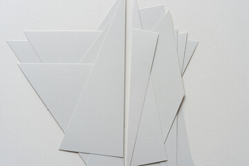 layered cut medium gray card stock shapes on blank paper