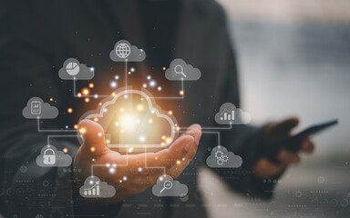 Big data analytics and business intelligence concept with chart and graph icons on a digital screen interface and a businessman in background