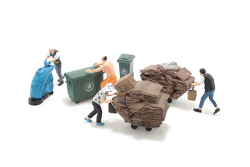 collects, weighs recycle material, cardboard and plastic bottles,