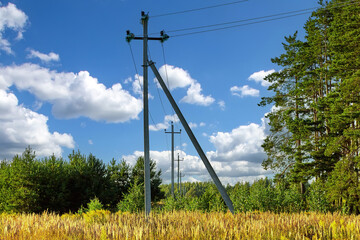 Power line support. Rustic elegraph pole full length against blue sky with clouds. Electric pole...