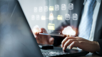 Cloud computing concept. Businessman using computer to backup storage data Internet technology. backup online documentation database and digital file storage system or software, file access. Cloud..