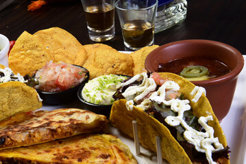 mexican tacos quesadillas and burritos with guacamole chilli salad jalapeno pepper typical tex mex cuisine