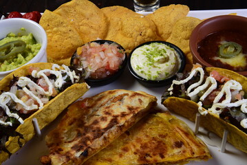 mexican tacos quesadillas and burritos with guacamole chilli salad jalapeno pepper typical tex mex cuisine