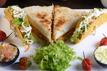 mexican tacos quesadillas and burritos with guacamole chilli salad jalapeno pepper typical tex mex cuisine