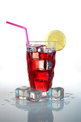 Fruit cocktail with ice and a slice of lemon on a white background