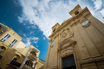 Fototapeta na wymiar Exterior of saint George cathedral or church in the city of Victoria on island of Gozo, Malta, on a sunny day.