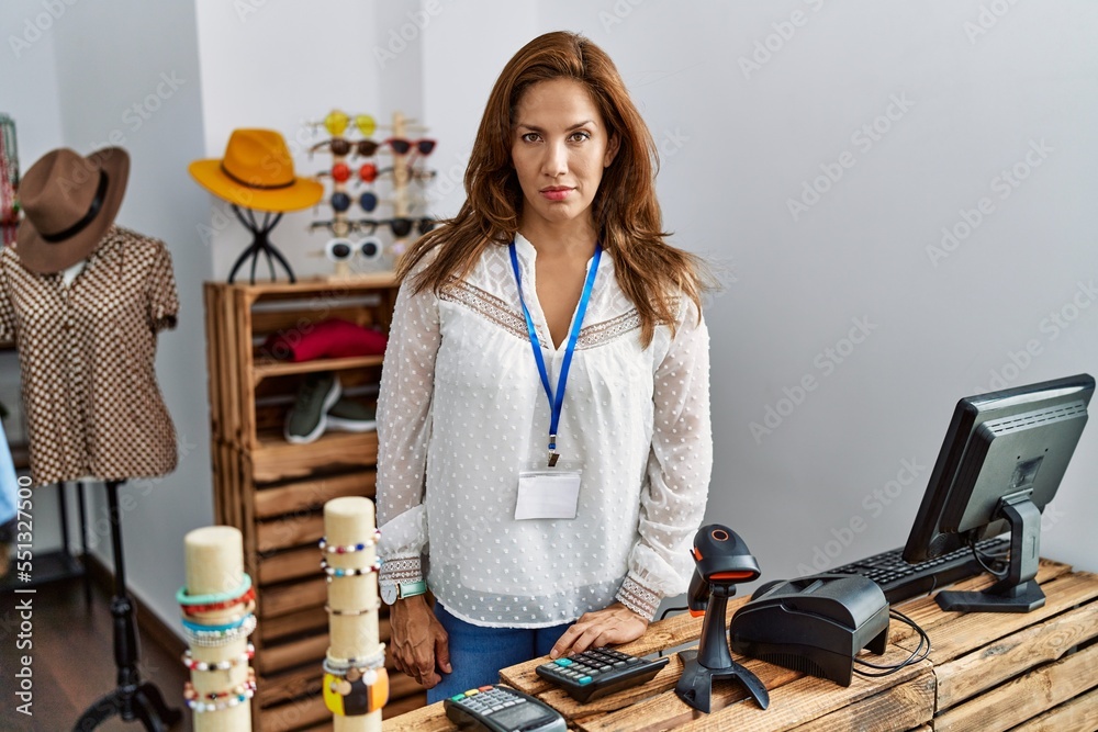 Canvas Prints Middle age hispanic woman working as manager at retail boutique skeptic and nervous, frowning upset because of problem. negative person.