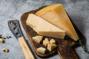 Parmesan cheese on a dark background close-up