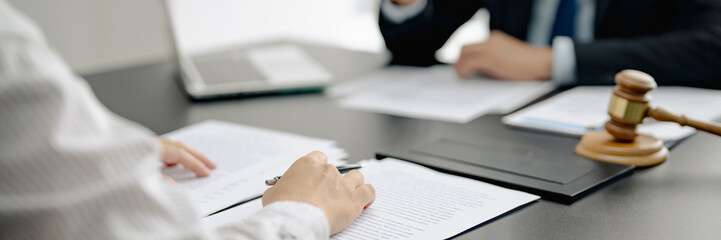Lawyer discuss the contract and legal document agreement in office. Law and legal concept.