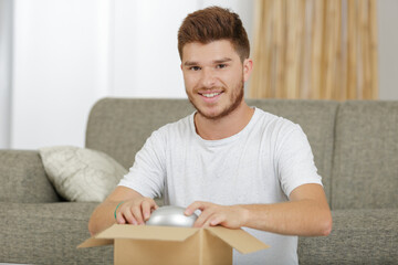 happy man moving boxes ready for relocation