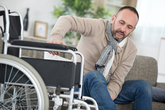 disable man is managing to sit on wheelchair