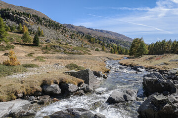 View of Claree river in Claree valley with Massif de Cerces mountains on either site, near Navache village and Briancon, Hautes-Alpes department, France