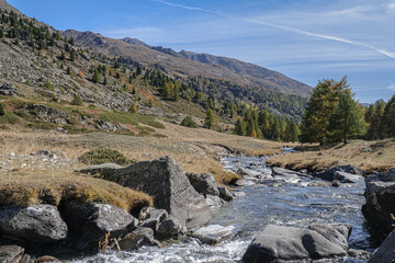 View of Claree river in Claree valley with Massif de Cerces mountains on either site, near Navache village and Briancon, Hautes-Alpes department, France