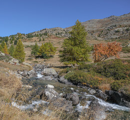 View of Claree river in Claree valley with Massif de Cerces mountains on either site, near Navache...