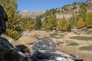 View of Claree river in Claree valley with Massif de Cerces mountains on either site, near Navache...