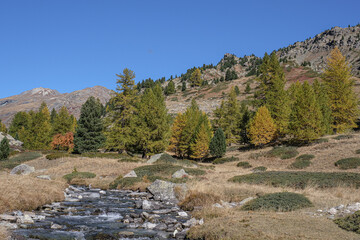 View of Claree river in Claree valley with Massif de Cerces mountains on either site, near Navache village and Briancon, Hautes-Alpes department, France