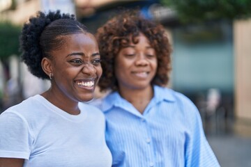 Fototapeta premium African american women mother and daughter standing together at street