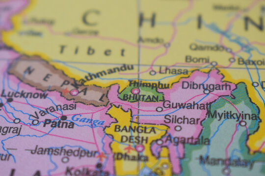 Bhutan Travel Concept Country Name On The Political World Map Very Macro Close-Up View Stock Photograph