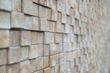 decorate a wall with square stones of different heights