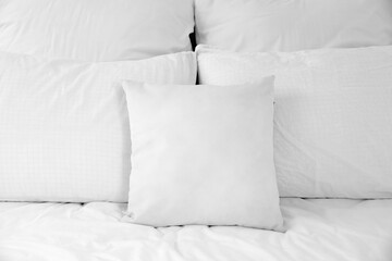 Soft pillows on comfortable bed, closeup