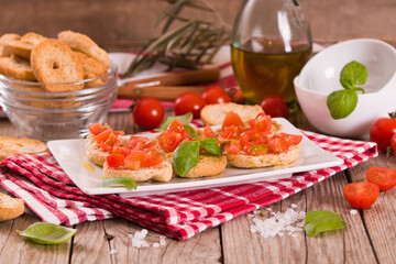 Friselle with cherry tomatoes and basil.