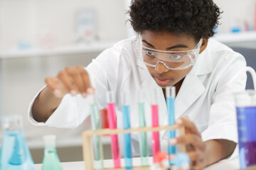 female researcher with two glasses in the lab